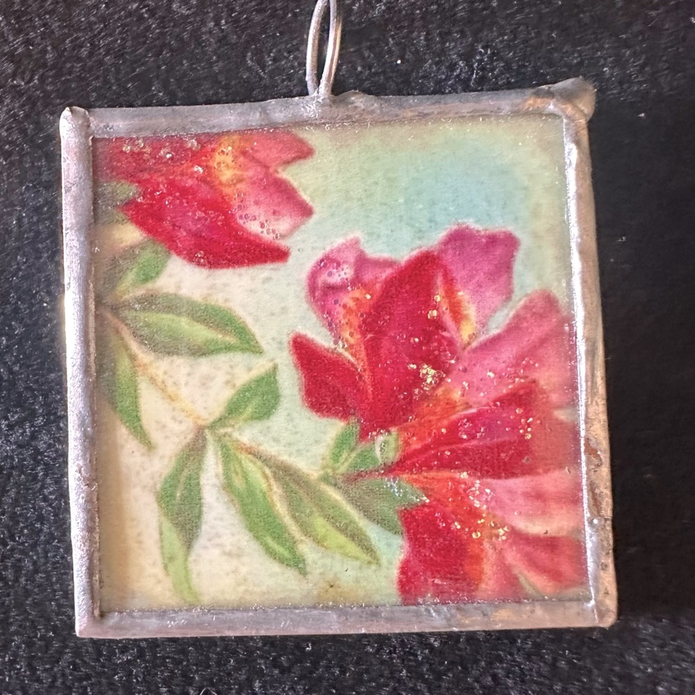 Women’s silver two-sided hammered floral and bird pendant. Feminine, colorful.